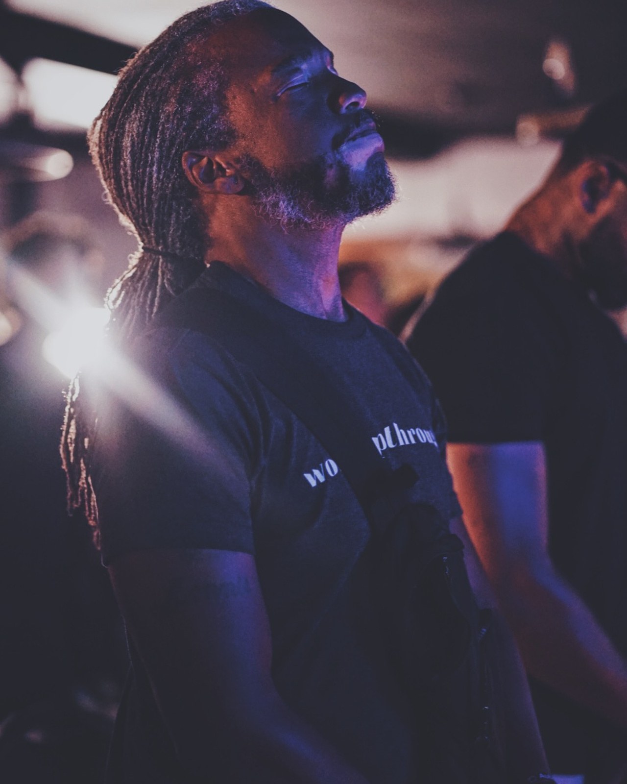 A man worshipping with his head lifted during a service